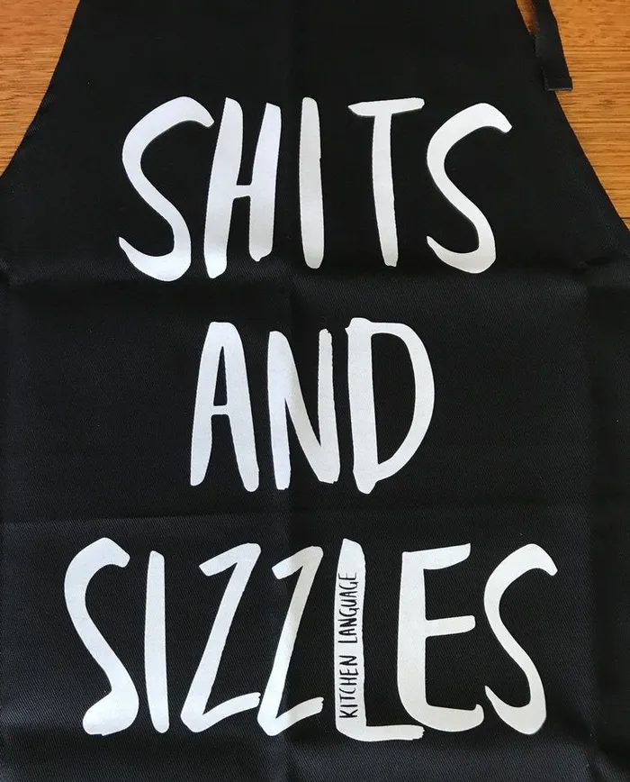 KITCHEN LANGUAGE Vibrators KITCHEN LANGUAGE SHITS AND SIZZLES APRON